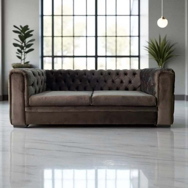 Front view of the Ashton Modern Chesterfield two-seater couch in dark grey velvet, with tufted backrest and arms.