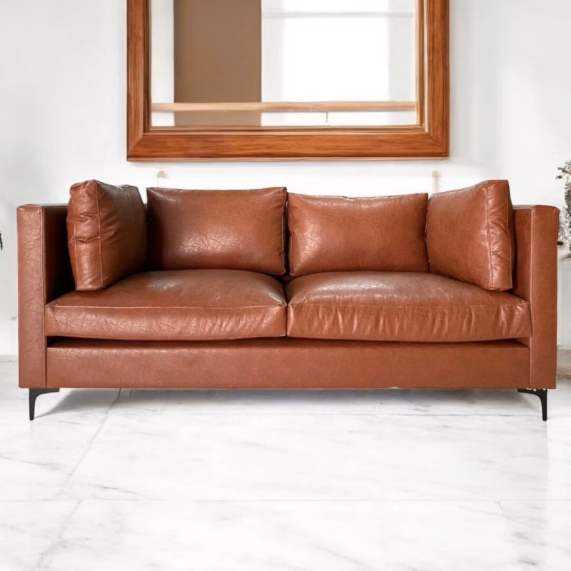 Front view of Baldwin Faux Leather 2-Seater Couch with plush back cushions